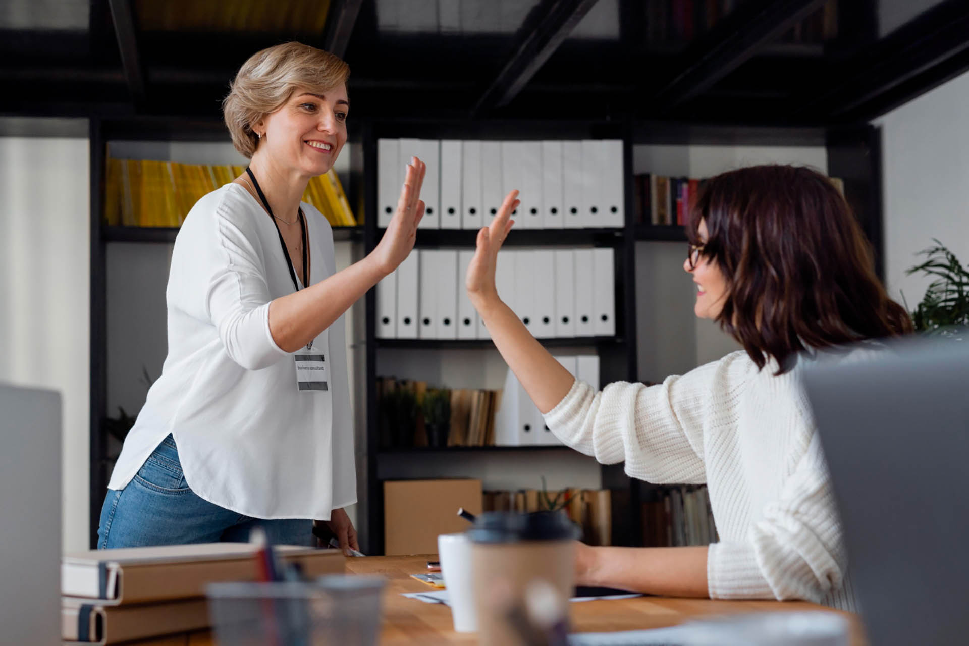 business women high five